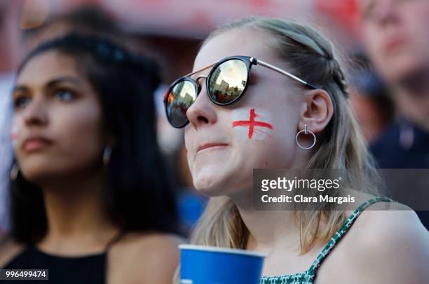 England fans react while watching the World Cup semi-final match against Croatia on a giant screen in an open air viewing area on July 11, 2018 in...