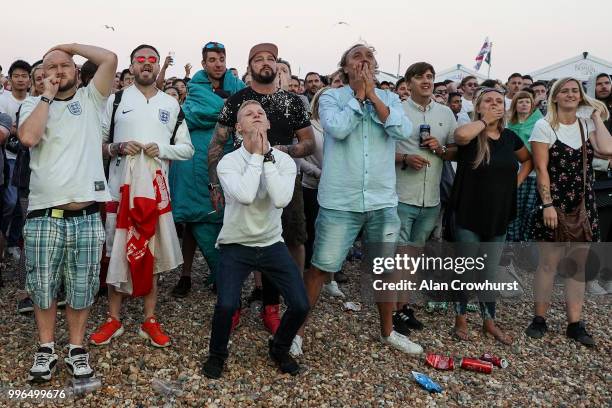England fans react during the 2018 FIFA World Cup semi final match between Croatia and England at the Luna Beach Cinema on Brighton Beach on July 11,...