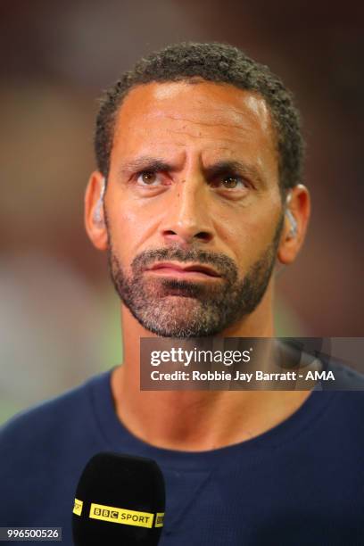 Rio Ferdinand performs pundit duties for the BBC at the end of the 2018 FIFA World Cup Russia Semi Final match between Croatia and England at...