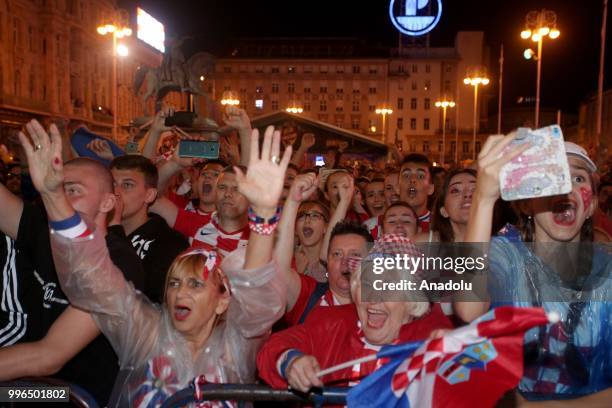 Fans of Croatia celebrate as they gather at Ban Jelacic Square for a public viewing event to watch 2018 FIFA World Cup Russia Semi Final match...