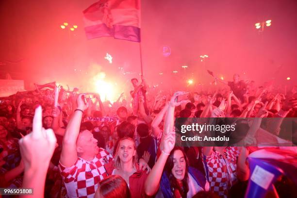 Fans of Croatia celebrate as they gather at Ban Jelacic Square for a public viewing event to watch 2018 FIFA World Cup Russia Semi Final match...