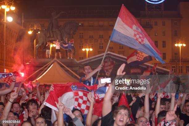 Fans of Croatia celebrate as they gather at Ban Jelacic Square for a public viewing event to watch 2018 FIFA World Cup Russia Semi Final match...