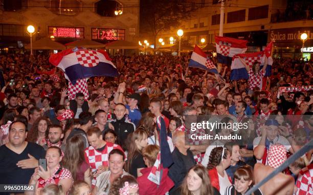 Fans of Croatia celebrate as they gather at Ban Jelacic Square for a public viewing event to watch 2018 FIFA World Cup Russia Semi Final match...