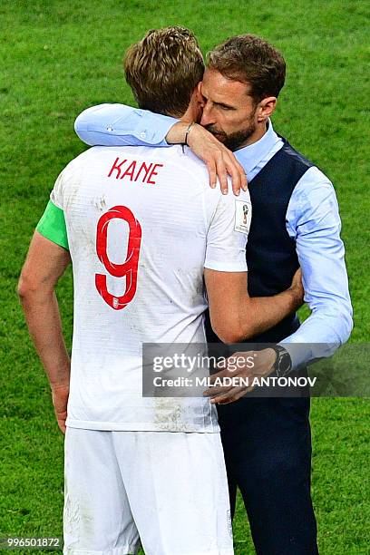 England's forward Harry Kane and England's coach Gareth Southgate react after losing the Russia 2018 World Cup semi-final football match between...