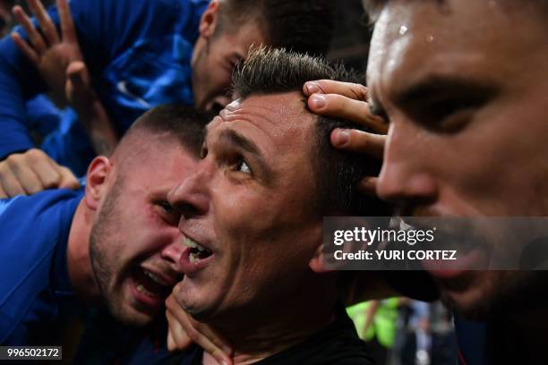 Croatia's forward Mario Mandzukic celebrates with teammates after scoring his team's second goal during the Russia 2018 World Cup semi-final football...