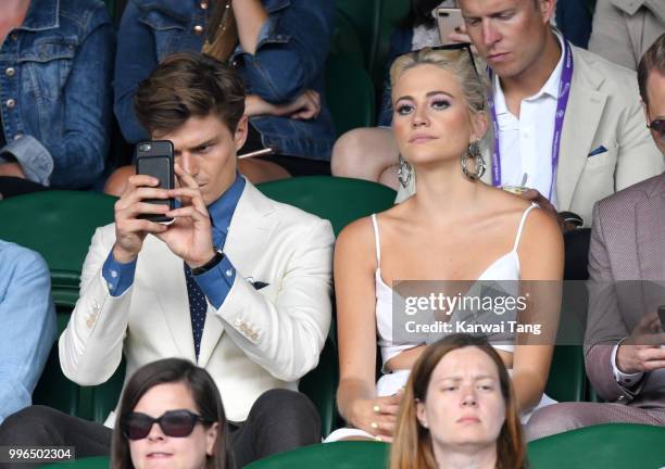 Oliver Cheshire and Pixie Lott attend day nine of the Wimbledon Tennis Championships at the All England Lawn Tennis and Croquet Club on July 11, 2018...