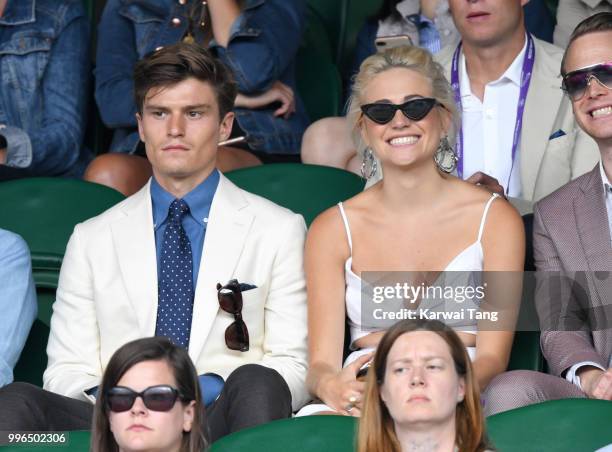 Oliver Cheshire and Pixie Lott attend day nine of the Wimbledon Tennis Championships at the All England Lawn Tennis and Croquet Club on July 11, 2018...