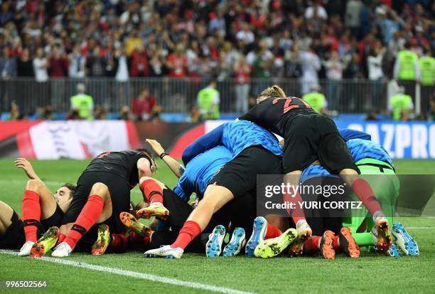 Croatia's players celebrate at the end of the Russia 2018 World Cup semi-final football match between Croatia and England at the Luzhniki Stadium in...