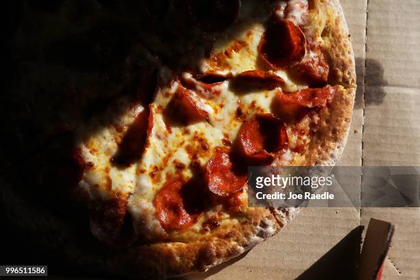 In this photo illustration, a Papa John's pizza is seen on July 11, 2018 in Miami, Florida. The founder of Papa John's pizza, John Schnatter,...