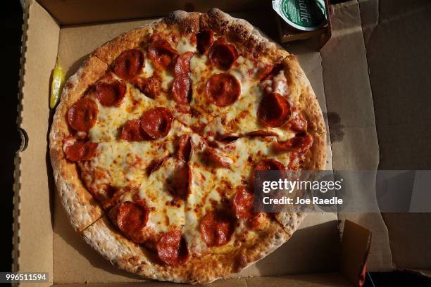 In this photo illustration, a Papa John's pizza is seen on July 11, 2018 in Miami, Florida. The founder of Papa John's pizza, John Schnatter,...