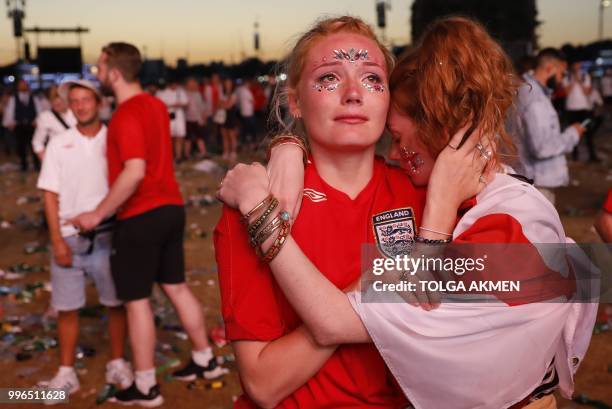 England supporters react at an outdoor screening in Hyde Park in central London as England lose the 2018 World Cup semi-final against Croatia in...