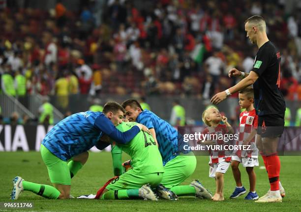 Croatia's goalkeeper Danijel Subasic celebrates with Croatia's goalkeeper Dominik Livakovic and Croatia's goalkeeper Lovre Kalinic next to Croatia's...