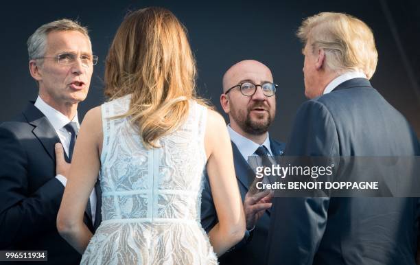 First Lady of the US Melania Trump listens to NATO Secretary General Jens Stoltenberg as her husband US President Donald Trump listens to Belgium's...