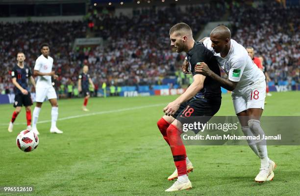 Ante Rebic of Croatia and Ashly Young of England in action during the 2018 FIFA World Cup Russia Semi Final match between England and Croatia at...
