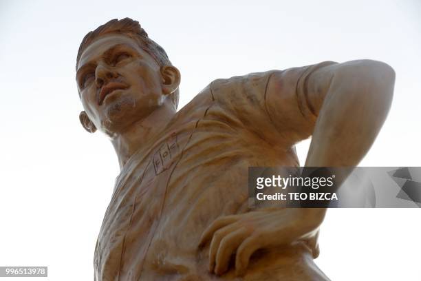 Picture taken on July 11, 2018 showing the statue of Peru's stricker Paolo Guerrero, erected along with that of national football team coach...