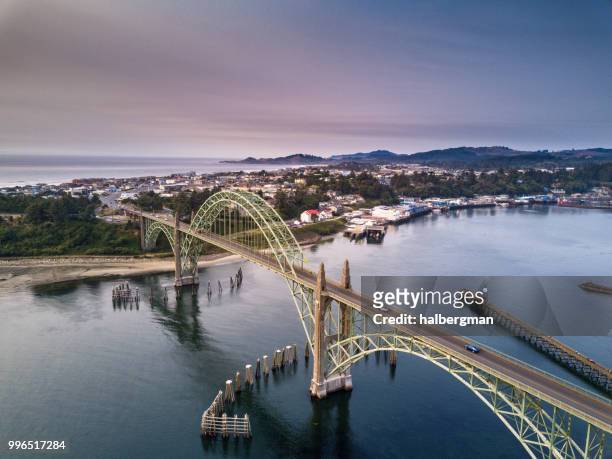 aerial view of yaquina bay bridge and newport, oregon - costa de oregon imagens e fotografias de stock