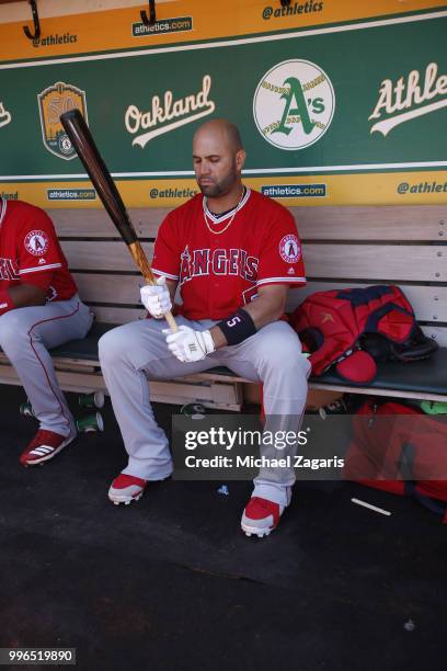 Albert Pujols of the Los Angeles Angels of Anaheim sits in the dugout prior to the game against the Oakland Athletics at the Oakland Alameda Coliseum...