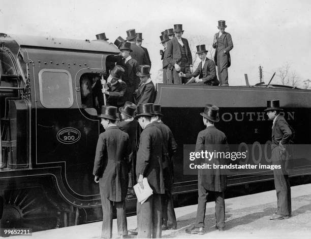 Induction of a railroad train, which is namend after the famous english school 'Eton'. Students of the famous school 'Eton' in England are checking...