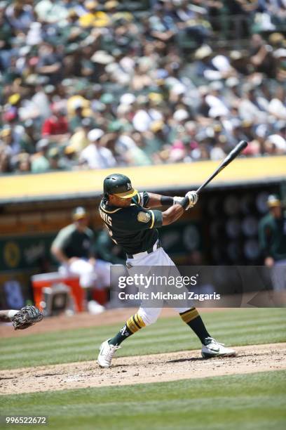 Khris Davis of the Oakland Athletics bats during the game against the Los Angeles Angels of Anaheim at the Oakland Alameda Coliseum on June 16, 2018...