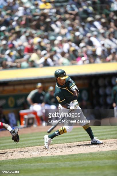 Khris Davis of the Oakland Athletics bats during the game against the Los Angeles Angels of Anaheim at the Oakland Alameda Coliseum on June 16, 2018...
