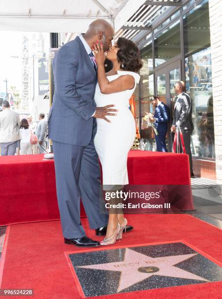 Jay Tucker and Niecy Nash pose for a photo as Niecy Nash is honored with a star on the Hollywood Walk Of Fame on July 11, 2018 in Hollywood,...