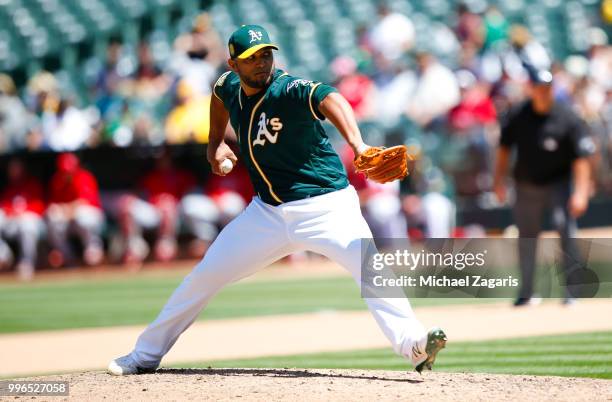Yusmeiro Petit of the Oakland Athletics pitches during the game against the Los Angeles Angels of Anaheim at the Oakland Alameda Coliseum on June 16,...