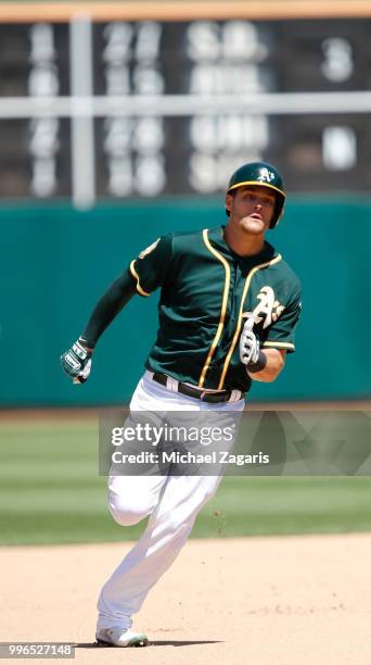 Chad Pinder of the Oakland Athletics runs the bases during the game against the Los Angeles Angels of Anaheim at the Oakland Alameda Coliseum on June...