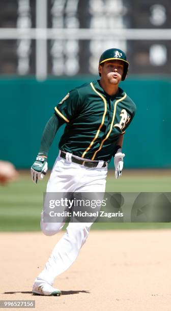 Chad Pinder of the Oakland Athletics runs the bases during the game against the Los Angeles Angels of Anaheim at the Oakland Alameda Coliseum on June...