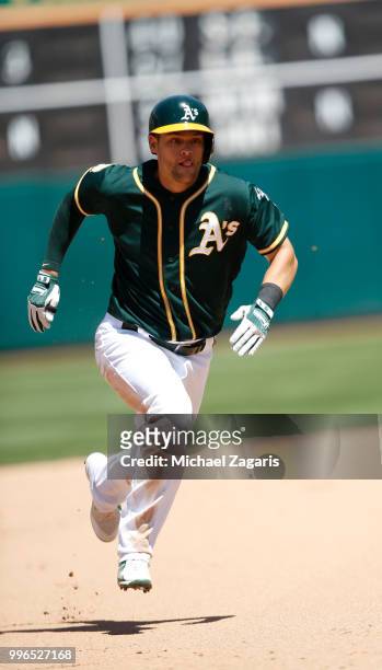 Chad Pinder of the Oakland Athletics runs the bases during the game against the Los Angeles Angels of Anaheim at the Oakland Alameda Coliseum on June...