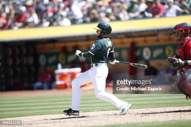 Jed Lowrie of the Oakland Athletics bats during the game against the Los Angeles Angels of Anaheim at the Oakland Alameda Coliseum on June 16, 2018...