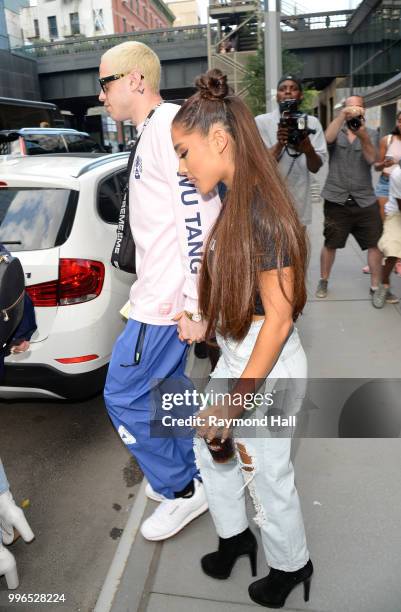 Singer Ariana Grande and Pete Davidson are seen walking in Midtown on July 11, 2018 in New York City.