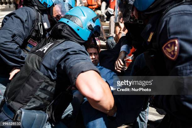 Italian police remove Riccardo Magi, Radicali Italiani National Secretary, during a protest organised by 'We remain human' network activist, that...