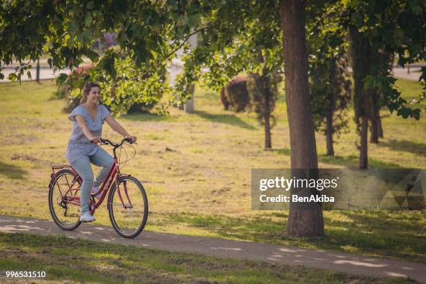 woman on bike trip during summer - weight loss journey stock pictures, royalty-free photos & images