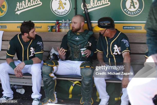 Dustin Fowler. Jonathan Lucroy and First Base Coach Al Pedrique of the Oakland Athletics talk in the dugout during the game against the Los Angeles...