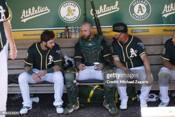 Dustin Fowler. Jonathan Lucroy and First Base Coach Al Pedrique of the Oakland Athletics talk in the dugout during the game against the Los Angeles...