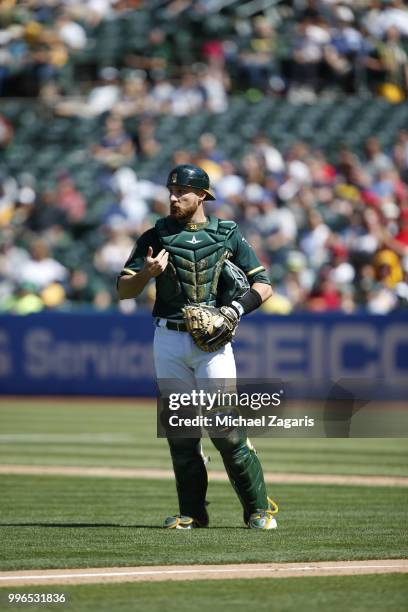 Jonathan Lucroy of the Oakland Athletics stands on the field during the game against the Los Angeles Angels of Anaheim at the Oakland Alameda...