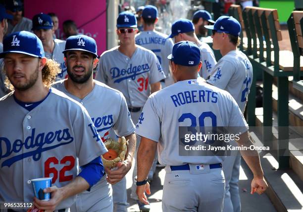 Manager Dave Roberts of the Los Angeles Dodgers walks through the dugout before the game against the Los Angeles Angels of Anaheim at Angel Stadium...