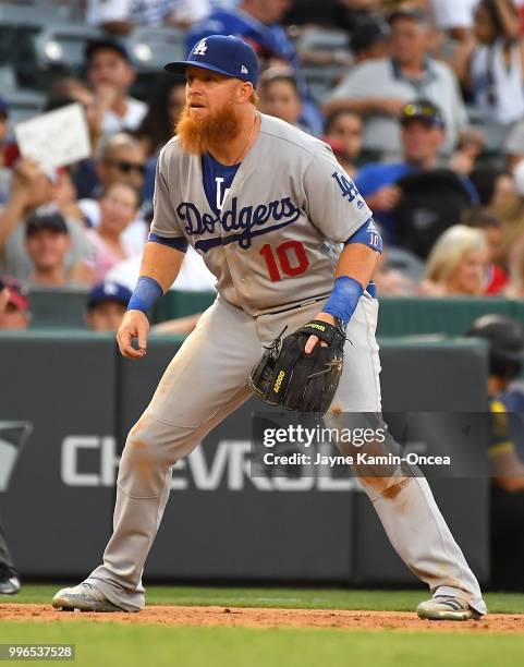 Justin Turner of the Los Angeles Dodgers plays at third base in the game against the Los Angeles Angels of Anaheim at Angel Stadium on July 8, 2018...