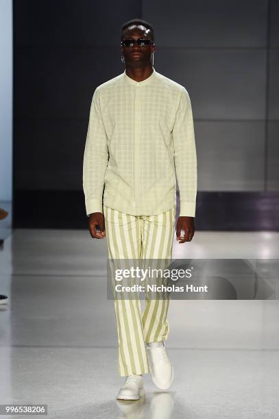 Model walks the runway at Head Of State+ show during New York York City Men's Fashion Week at Cadillac House on July 11, 2018 in New York City.