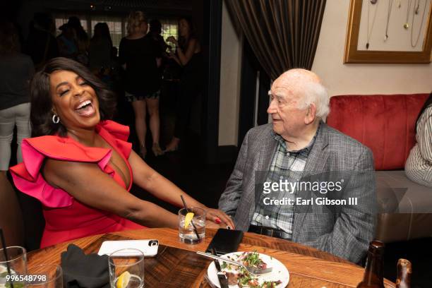 Niecy Nash and Ed Asner share a laugh at the after-party in honor of her star on the Hollywood Walk Of Fame on July 11, 2018 in Hollywood, California.