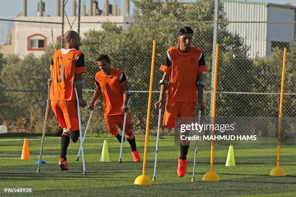 Palestinian amputee soccer players take part in a training session of their team at Municipality Stadium in Deir Al Balah, in the central Gaza Strip,...
