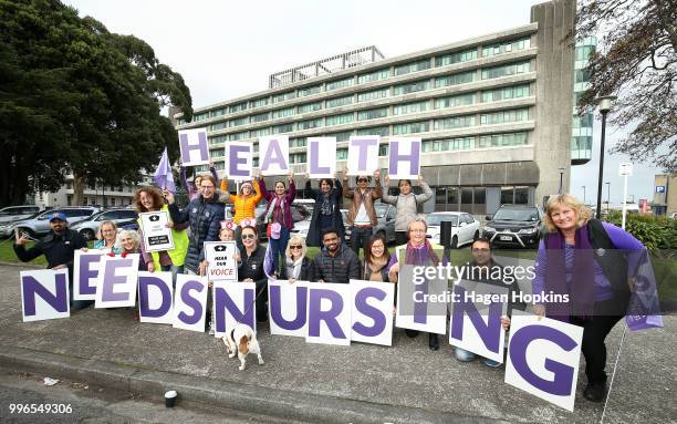 Nurses and Workers Union members hold signs during a strike at Hutt Hospital on July 12, 2018 in Lower Hutt, New Zealand. Thousands of nurses voted...