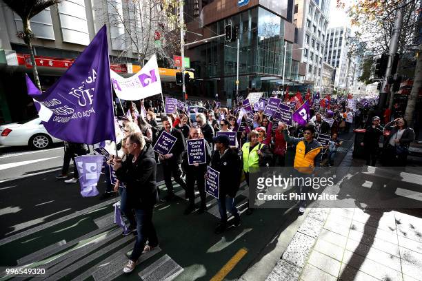 Nurses and Workers Union Members march up Queen Street on July 12, 2018 in Auckland, New Zealand. Thousands of nurses voted to walk off the job for...