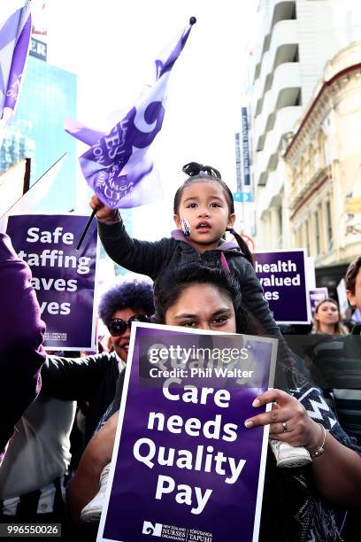 Nurses and Workers Union Members march up Queen Street on July 12, 2018 in Auckland, New Zealand. Thousands of nurses voted to walk off the job for...