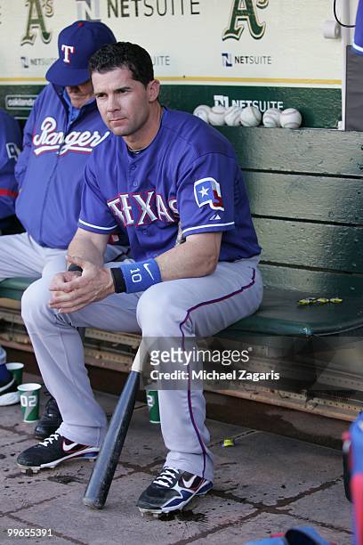 Michael Young of the Texas Rangers sitting in the dugout prior to the game against the Oakland Athletics at the Oakland Coliseum on May 3, 2010 in...