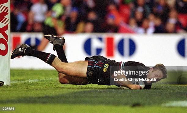 Ben Reynolds for Penrith scores a try during the round 20 NRL match played between the Penrith Panthers and the Sydney Roosters held at Penrith...