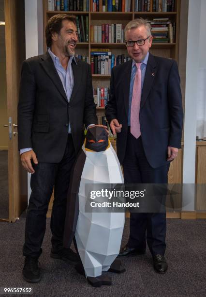 Javier Bardem meets with UK Environment Secretary Michael Gove on July 09, 2018 in Cambridge, England. Scientists attended an evening event with...