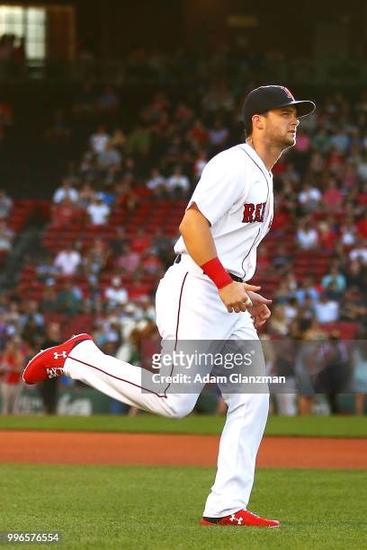 Andrew Benintendi of the Boston Red Sox warms up before a game against the Texas Rangers at Fenway Park on JULY 9, 2018 in Boston, Massachusetts.