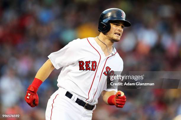 Andrew Benintendi of the Boston Red Sox runs to first base during a game against the Texas Rangers at Fenway Park on JULY 9, 2018 in Boston,...