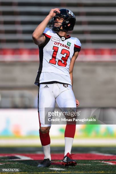 Kicker Richie Leone of the Ottawa Redblacks looks on during the warmup against the Montreal Alouettes prior to the CFL game at Percival Molson...